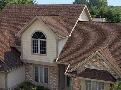 Home with red-ish brown Owens Corning shingles on its roof